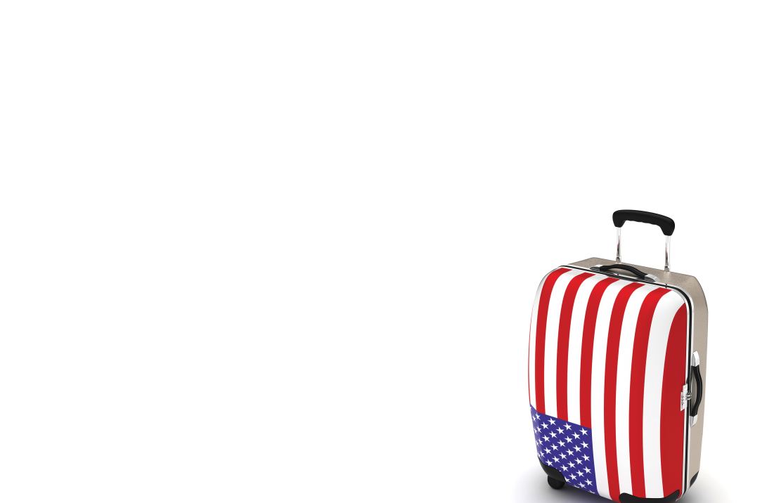 Hardshell suitcase covered in USA flag wrap
